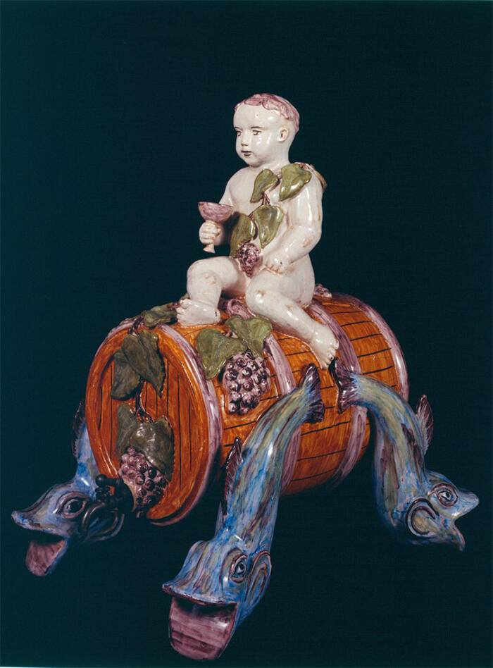 Wine fountain, Bacchus child sitting on a barrel, tin-glazed earthenware, Desvres factory, 1923<br/> &copy;  madd Bordeaux - L. Gauthier